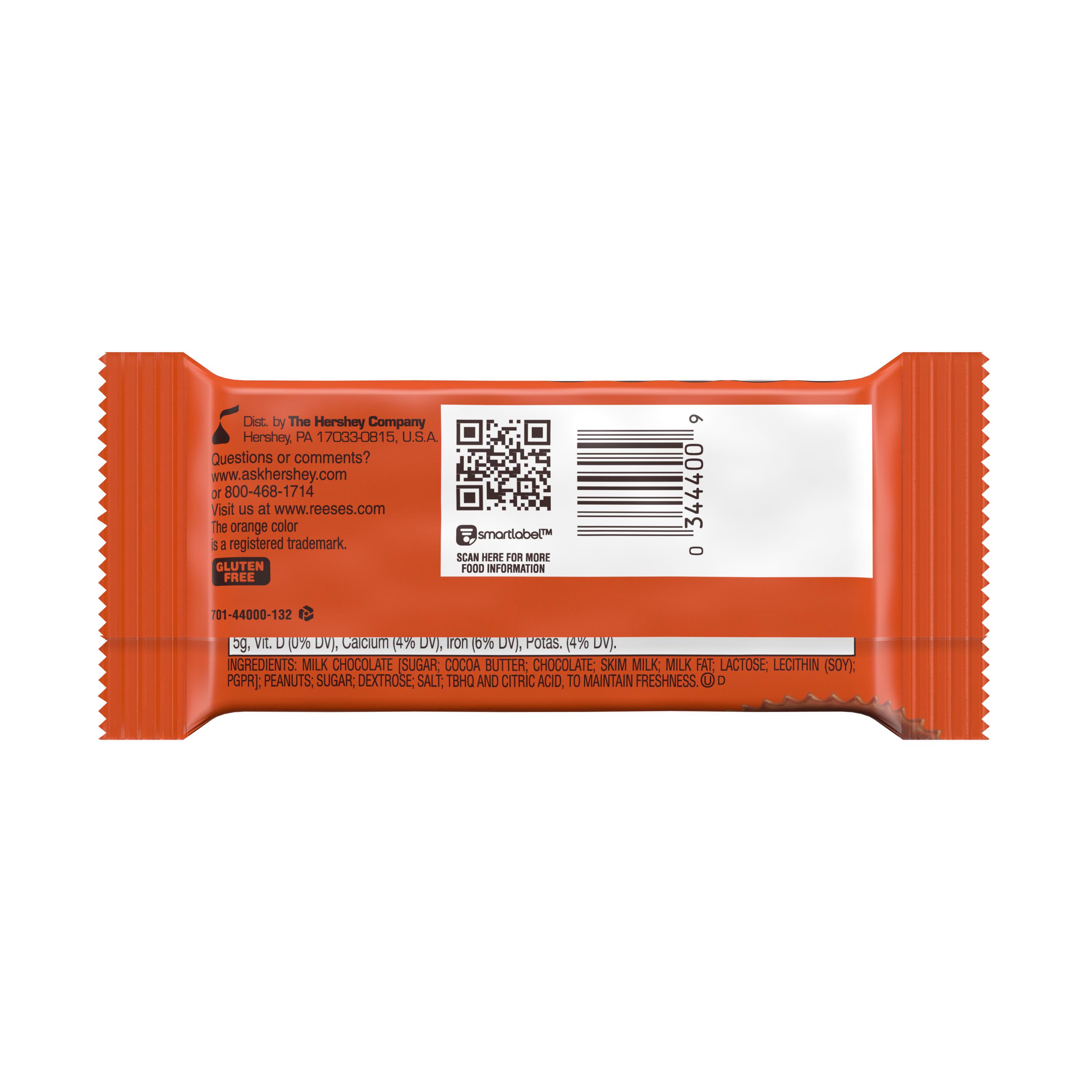 L’arrière de l’emballage orange sur fond blanc avec un encadré blanc, un QR code et un code-barre